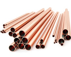Copper tubes on white background